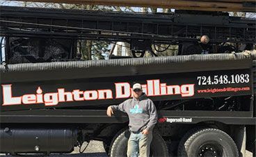 James in front of Leighton Drilling Truck